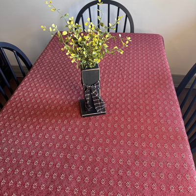 Kitchen table with red and tan table cloth in the Packsville Rose Pattern - Primitive Star Quilt Shop