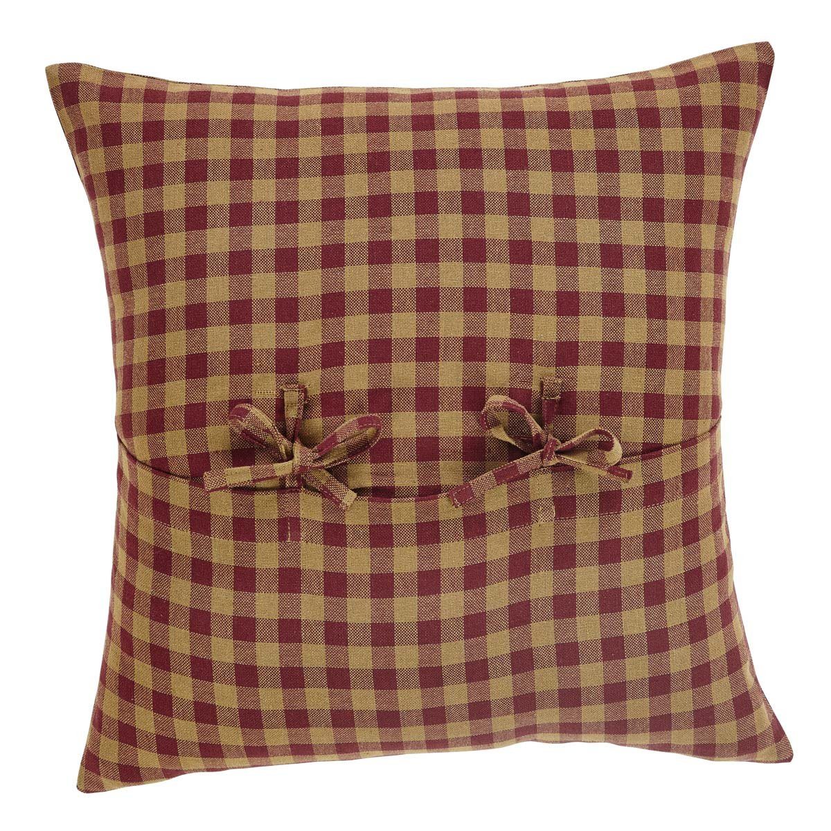 Burgundy and tan throw pillows top